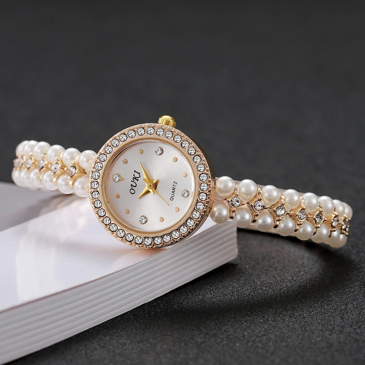 Shine with charming femininity a watch adorned with pearls and gold luster focused on attractiveness and beauty your wrist